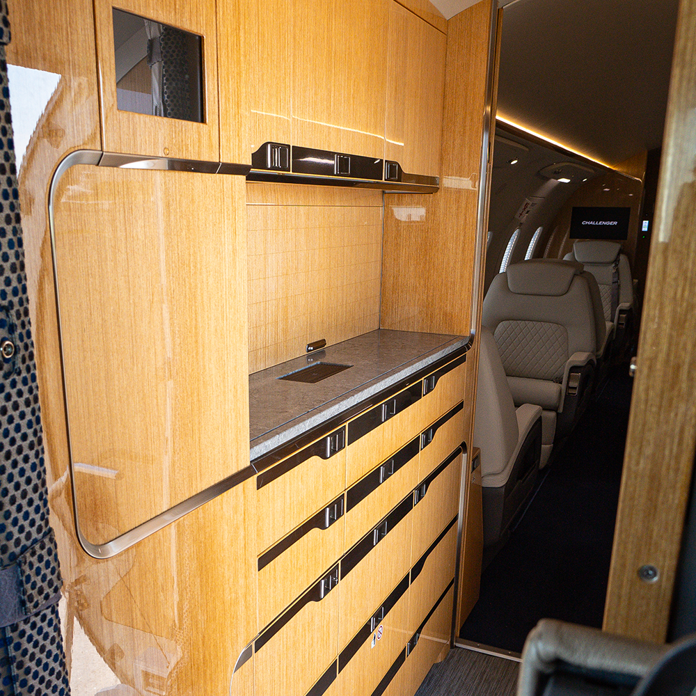 A wood-veneer galley credenza after refurbishment