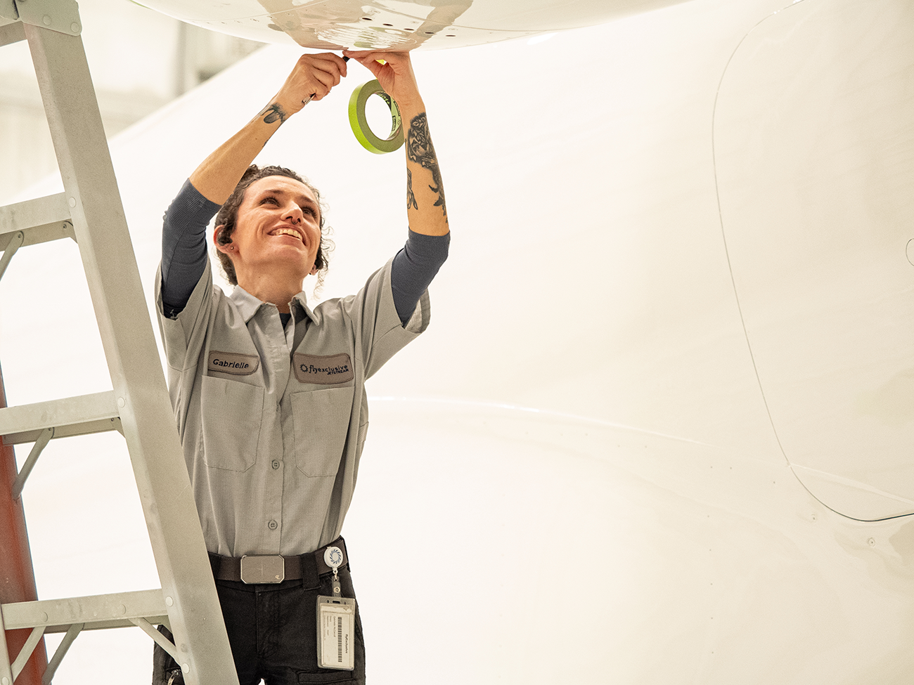 A painter at work in the flyExclusive electrostatic paint facility