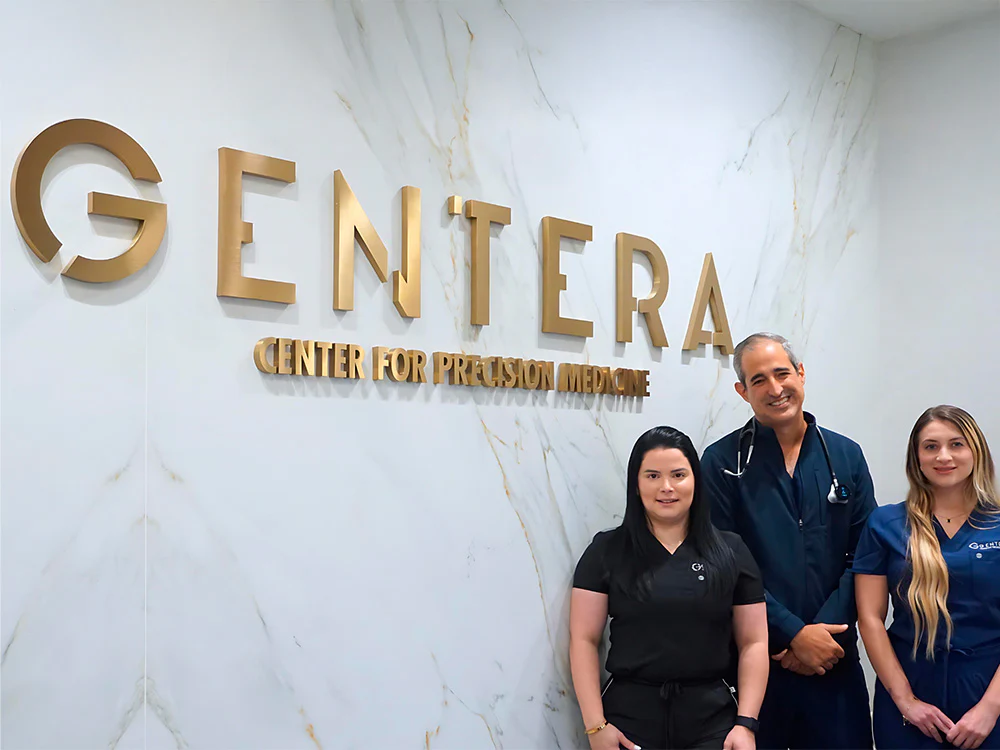 The Gentera Center for Precision Medicine team beneath the Gentera sign