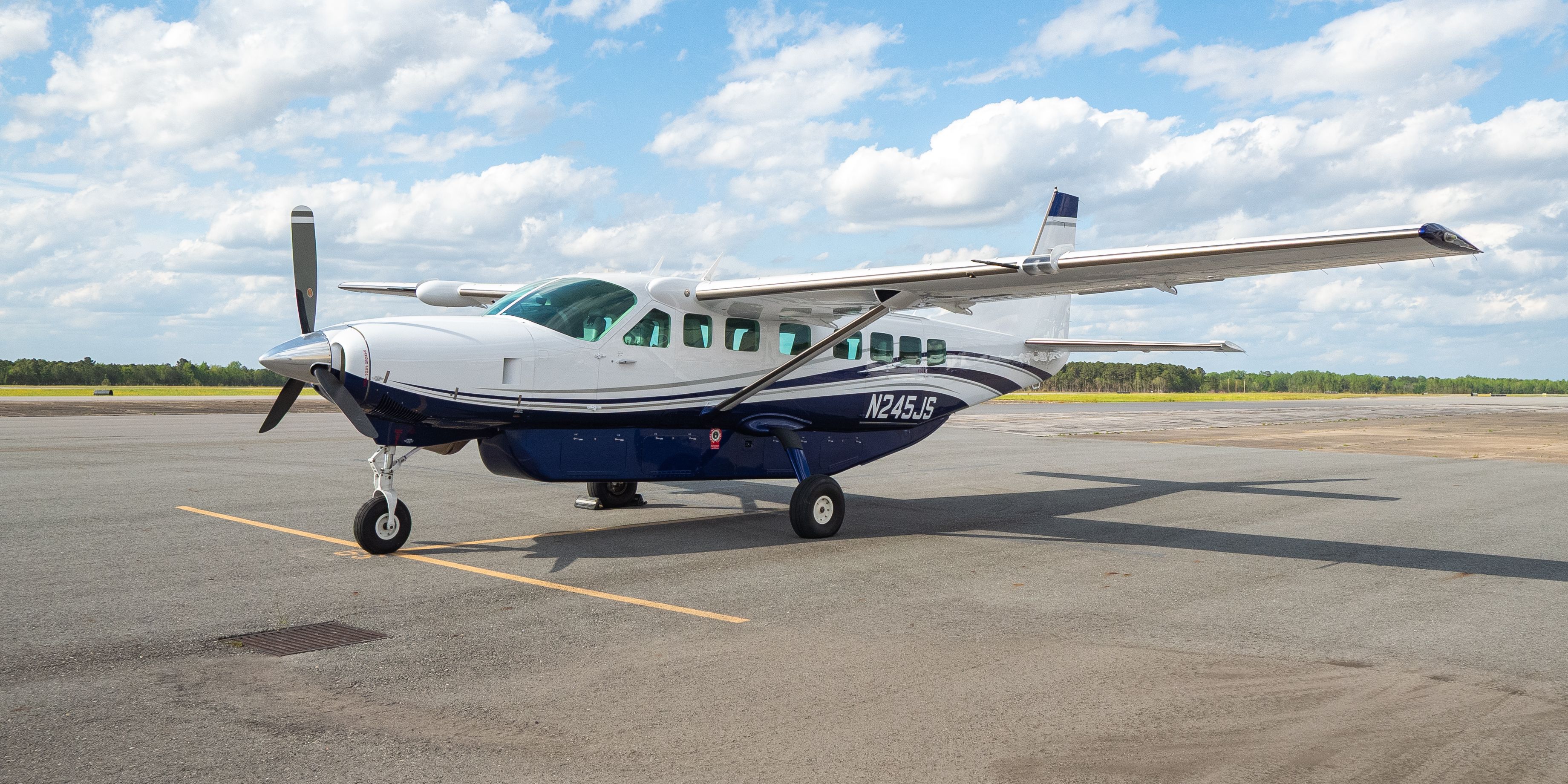 A flyExclusive Caravan on the runway ramp