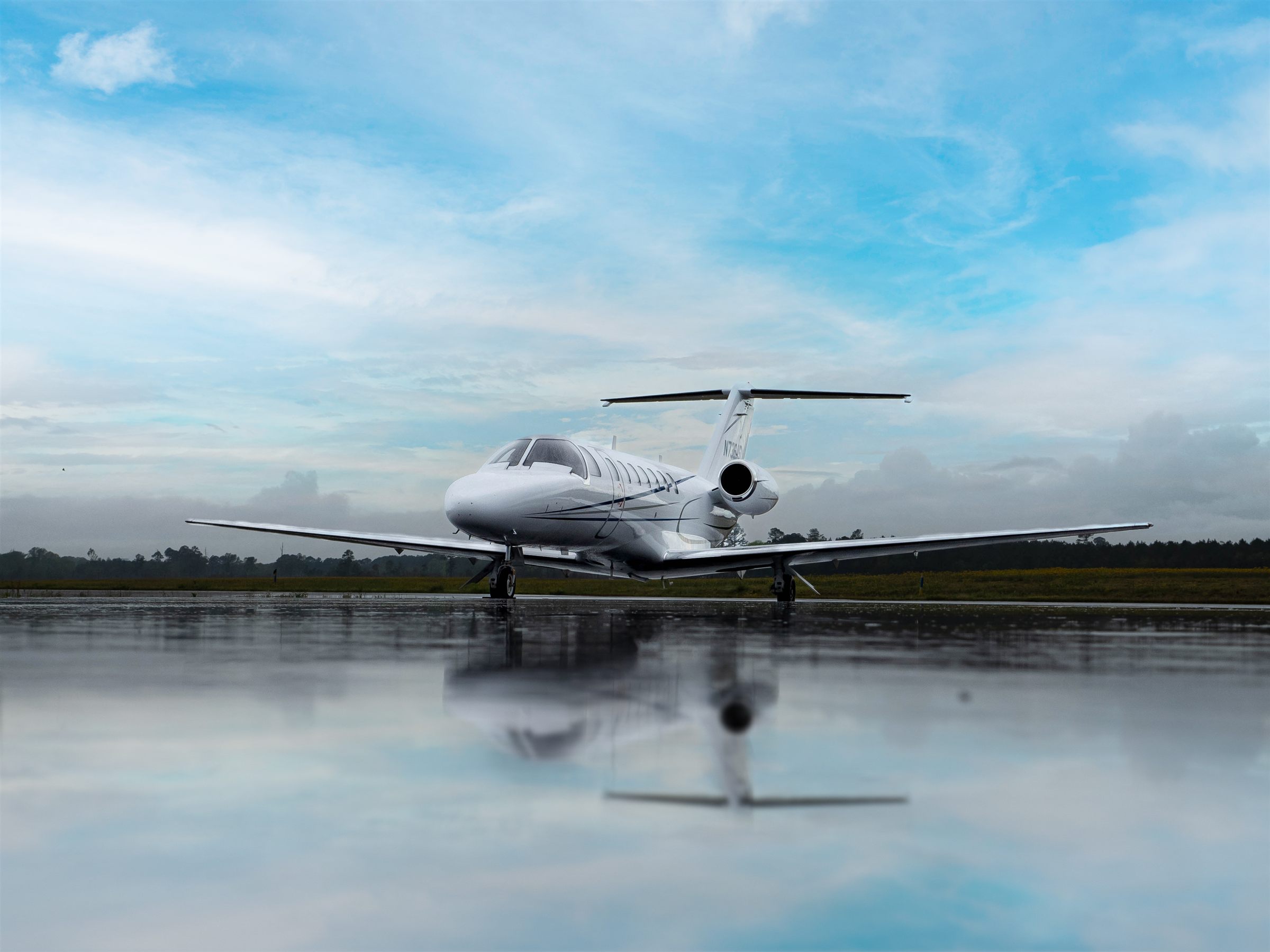 Citation CJ3+ on a mirror-still lake ramp